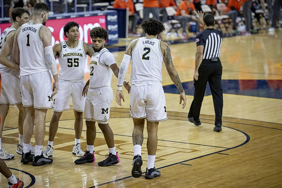 Franz Wagner (21), Hunter Dickinson (1), Eli Brooks (55), Mike Smith (12), and Isaiah Livers (2)
