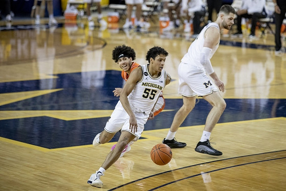 Eli Brooks (55) and Hunter Dickinson (1)