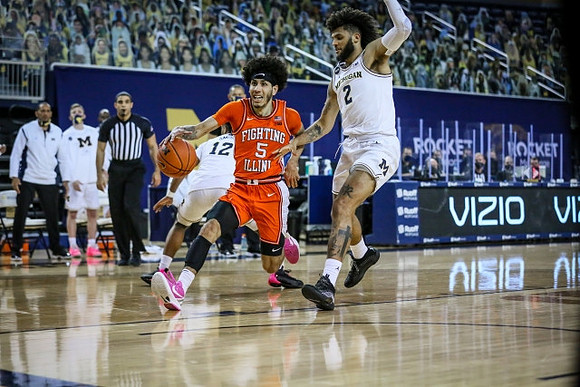 Mike Smith (12) and Isaiah Livers (2)