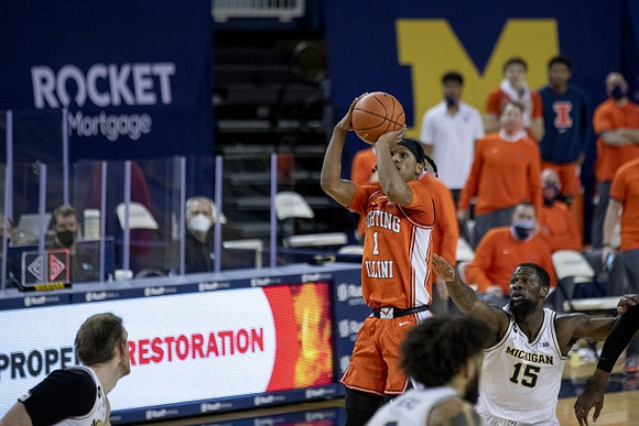 Austin Davis (51), Isaiah Livers (2), and Chaundee Brown Jr. (15)