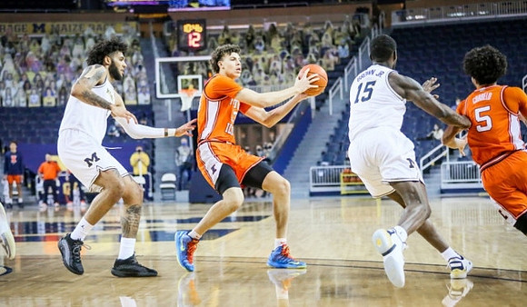 Isaiah Livers (2) and Chaundee Brown Jr. (15)
