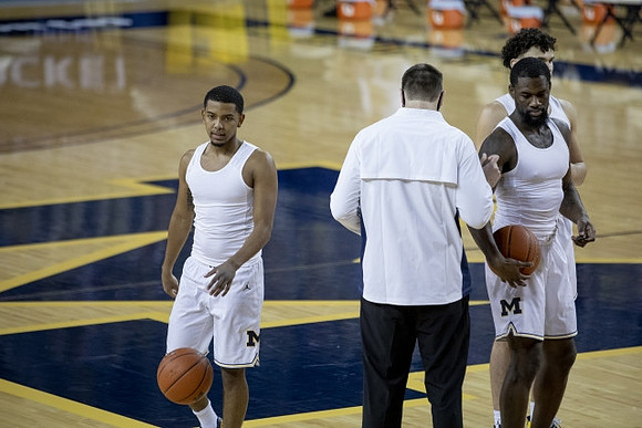 Rico Ozuna-Harrison (14), Chaundee Brown Jr. (15), and Adrien Nunez (0)