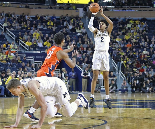 Moritz Wagner (13) and Jordan Poole (2)