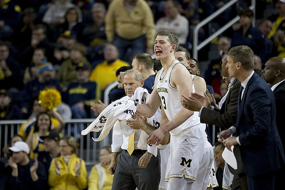 John Beilein, Moritz Wagner (13), and Luke Yaklich