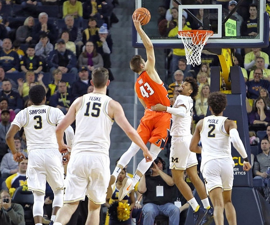 Zavier Simpson (3), Jon Teske (15), Isaiah Livers (4), and Jordan Poole (2)