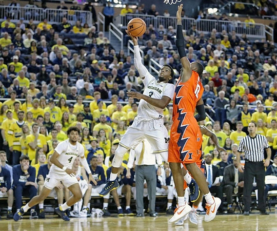Zavier Simpson (3) and Isaiah Livers (4)