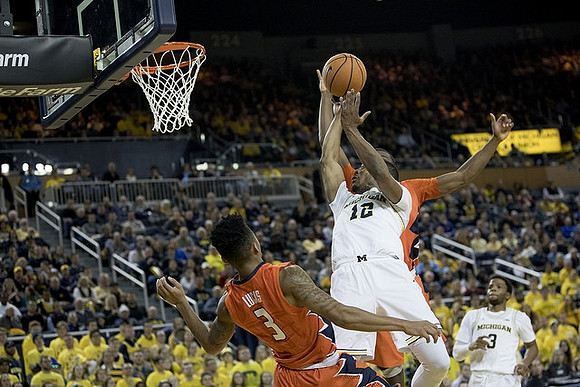 Muhammad-Ali Abdur-Rahkman (12) and Zavier Simpson (3)
