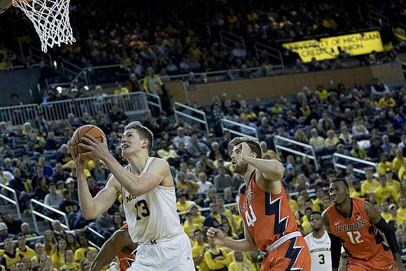 Moritz Wagner (13) and Zavier Simpson (3)