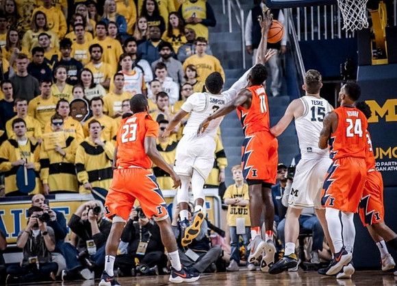 Zavier Simpson (3) and Jon Teske (15)