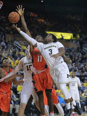 Zavier Simpson (3), Jon Teske (15), and Muhammad-Ali Abdur-Rahkman (12)