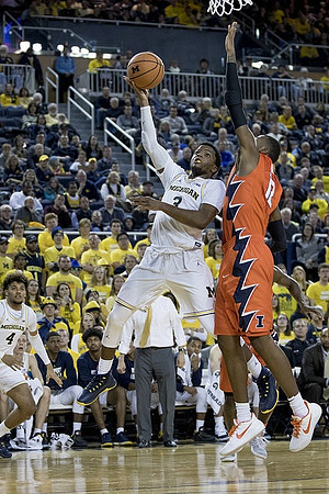 Zavier Simpson (3) and Isaiah Livers (4)