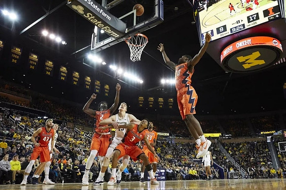 Duncan Robinson (22), Moritz Wagner (13), and Jordan Poole (2)