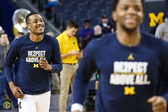 Muhammad-Ali Abdur-Rahkman (12) and Zavier Simpson (3)
