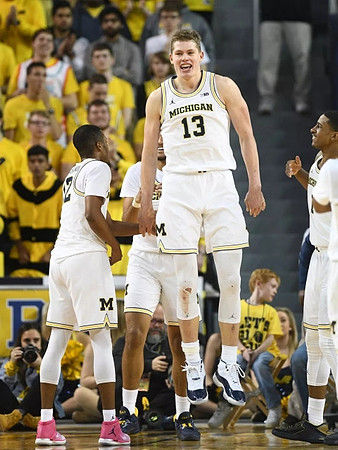 Muhammad-Ali Abdur-Rahkman (12), Isaiah Livers (4), Charles Matthews (1), and Moritz Wagner (13)
