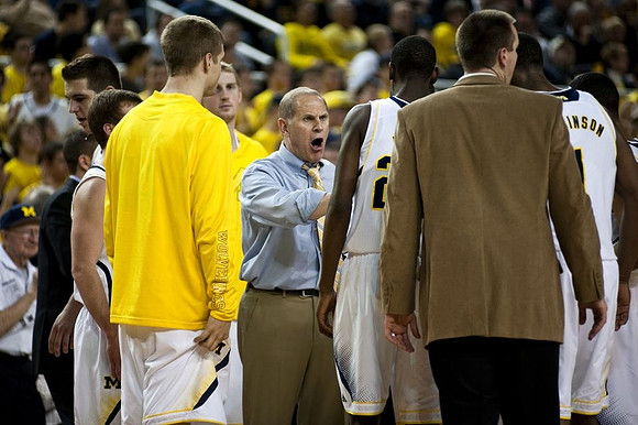 Max Bielfeldt (44), Blake McLimans (22), John Beilein, Caris LeVert (23), and Glenn Robinson III (1)