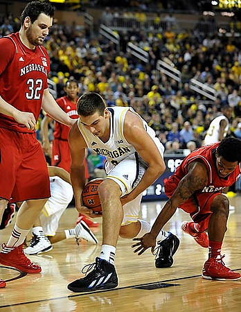 Mitch McGary (4) and Caris LeVert (23)