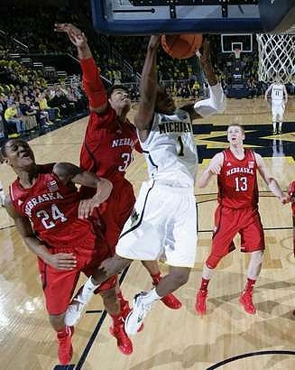 Glenn Robinson III (1) and Nik Stauskas (11)