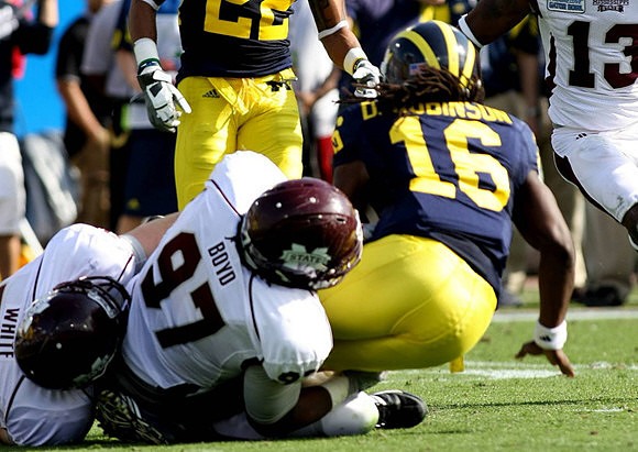 Darryl Stonum (22) and Denard Robinson (16)