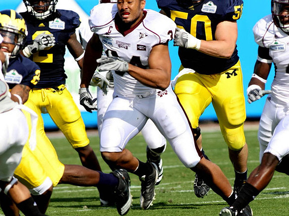 Darryl Stonum (22), Vincent Smith (2), and David Molk (50)