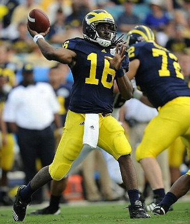 Denard Robinson (16) and Mark Huyge (72)