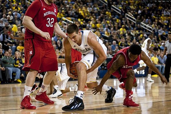 Mitch McGary (4) and Caris LeVert (23)