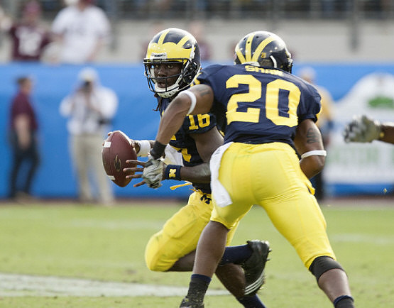Denard Robinson (16) and Michael Shaw (20)