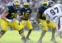 Perry Dorrestein (79), Denard Robinson (16), and Patrick Omameh (65)