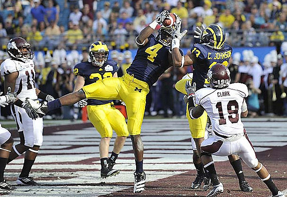 Jordan Kovacs (32), Cameron Gordon (4), and Carvin Johnson (13)