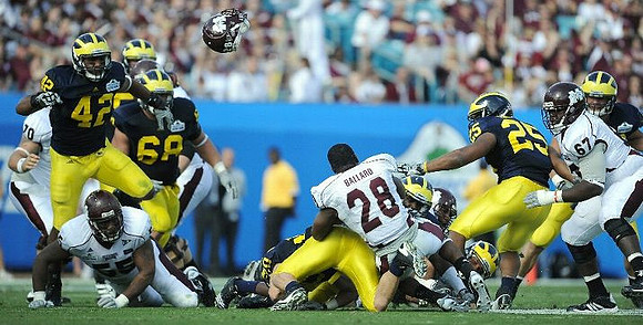 J.B. Fitzgerald (42), Mike Martin (68), Ray Vinopal (20), Jonas Mouton (8), and Kenny Demens (25)