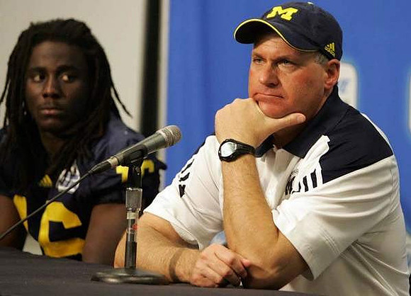 Denard Robinson (16) and Rich Rodriguez
