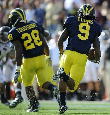 Fitzgerald Toussaint (28) and Martavious Odoms (9)