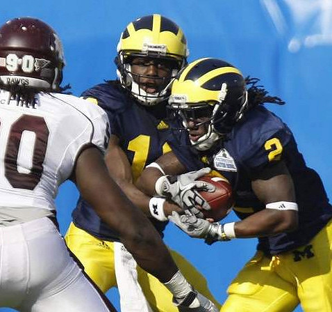 Denard Robinson (16) and Vincent Smith (2)
