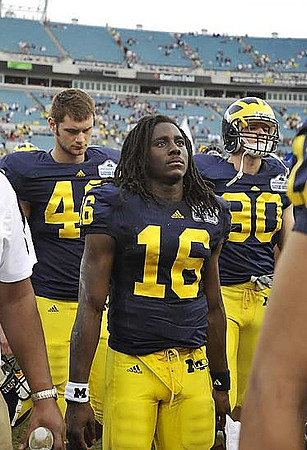 Nate Allspach (40), Denard Robinson (16), and Erik Gunderson (90)