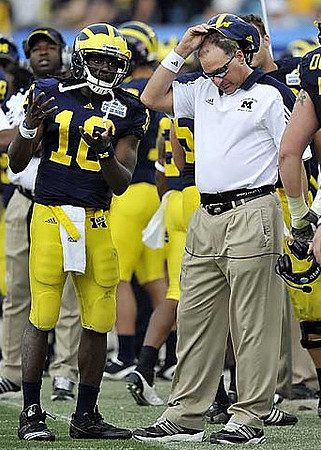 Denard Robinson (16) and Rich Rodriguez