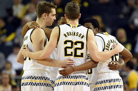 Mark Donnal (34), Duncan Robinson (22), Muhammad-Ali Abdur-Rahkman (12), Derrick Walton Jr. (10), and Zak Irvin (21)