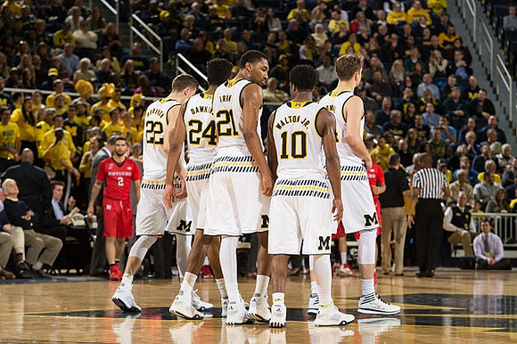 Duncan Robinson (22), Aubrey Dawkins (24), Zak Irvin (21), Derrick Walton Jr. (10), and Mark Donnal (34)