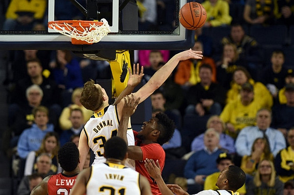Mark Donnal (34), Zak Irvin (21), and Muhammad-Ali Abdur-Rahkman (12)