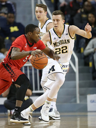 Mark Donnal (34) and Duncan Robinson (22)