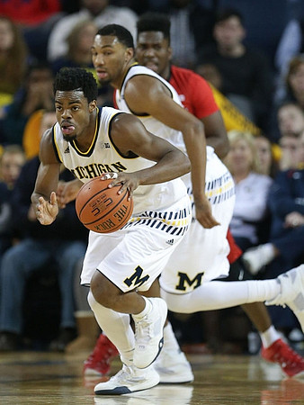 Derrick Walton Jr. (10) and Zak Irvin (21)