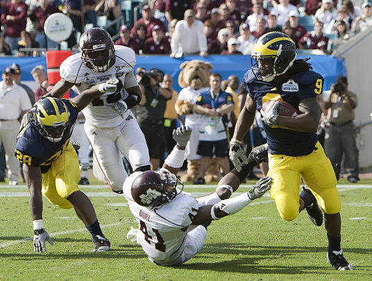 Fitzgerald Toussaint (28) and Martavious Odoms (9)