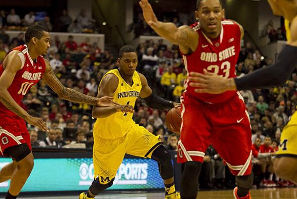Jon Horford (15) and Caris LeVert (23)