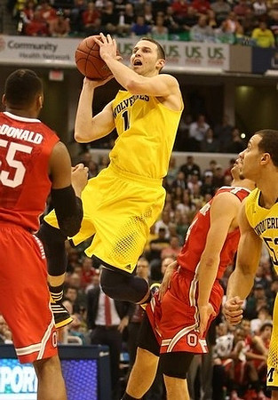 Nik Stauskas (11) and Derrick Walton Jr. (10)