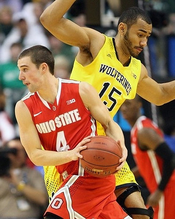 Derrick Walton Jr. (10) and Caris LeVert (23)
