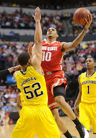 Jordan Morgan (52) and Glenn Robinson III (1)