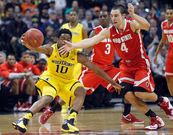 Derrick Walton Jr. (10) and Glenn Robinson III (1)