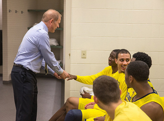 Mark Donnal (34), Andrew Dakich (5), Max Bielfeldt (44), Derrick Walton Jr. (10), and Zak Irvin (21)