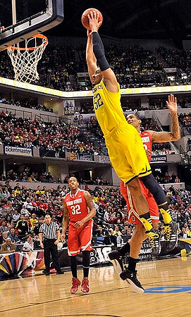 Jon Horford (15) and John Beilein