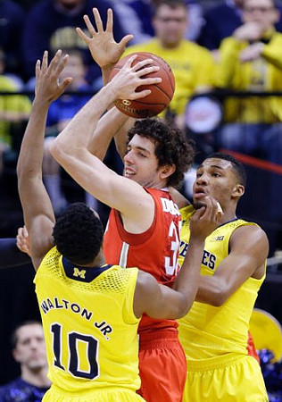 Derrick Walton Jr. (10) and Zak Irvin (21)