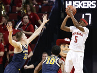 Duncan Robinson (22) and Derrick Walton Jr. (10)