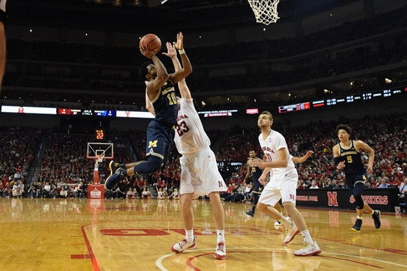 Derrick Walton Jr. (10) and D.J. Wilson (5)